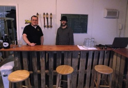 Brass Cannon Brewing was opened a year ago but college buddies Tony Artrip (left), Phil Norfolk (right) and Scott Kennedy (not pictured). (Photo by Brittany Voll/WYDaily)