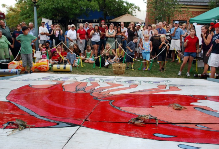 At Berret's Annual Crab Race, crabs dash across a racetrack to raise money for the Chesapeake Bay Foundation.