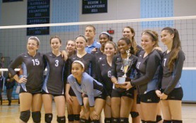 Warhill's volleyball team hoists the program's first-ever region championship trophy. (Submitted photo)