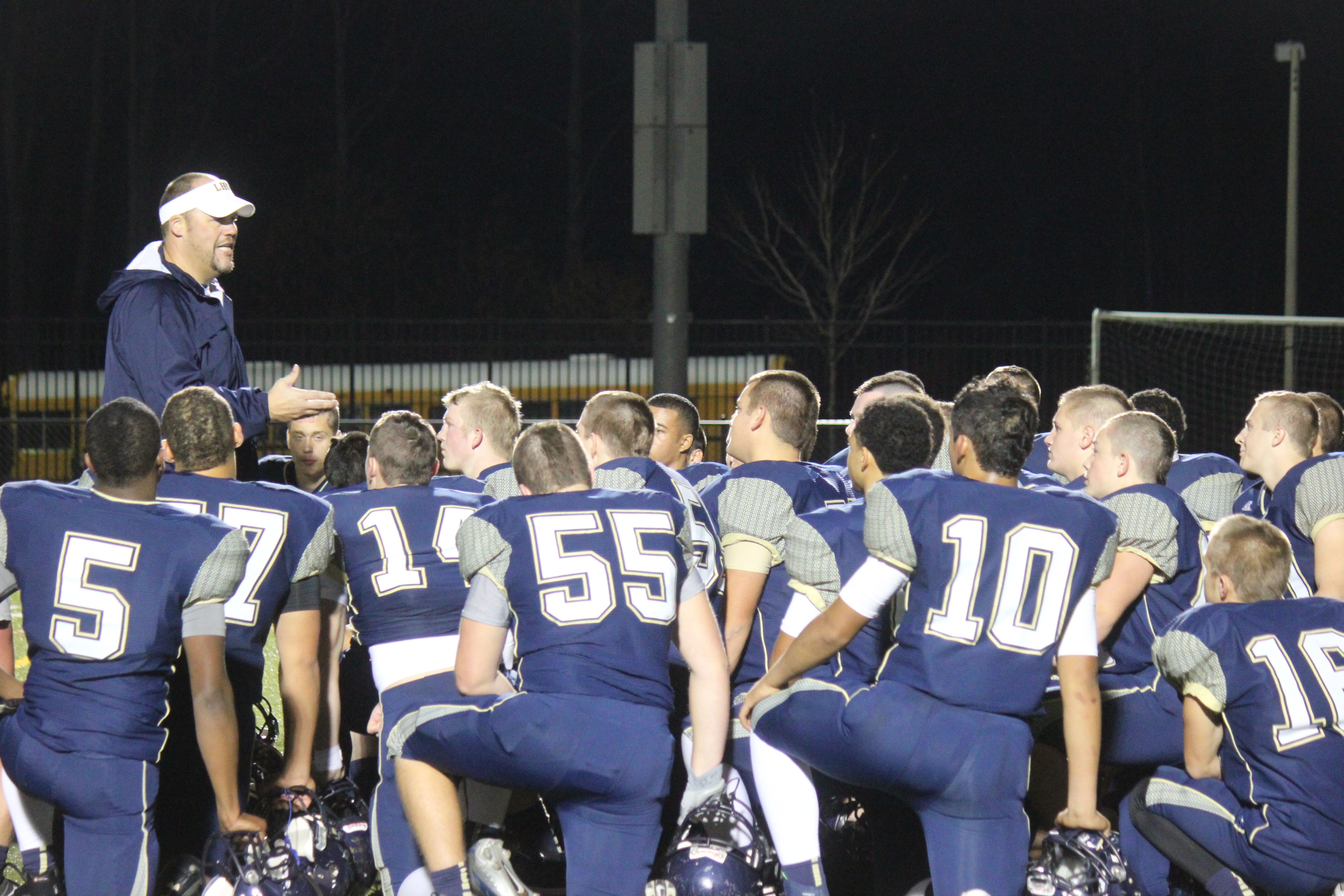 Rams Coach Andy Linn speaks with his football squad after their 63-7 rout over Warren County on Friday night. (Nicole Trifone/WYDaily)