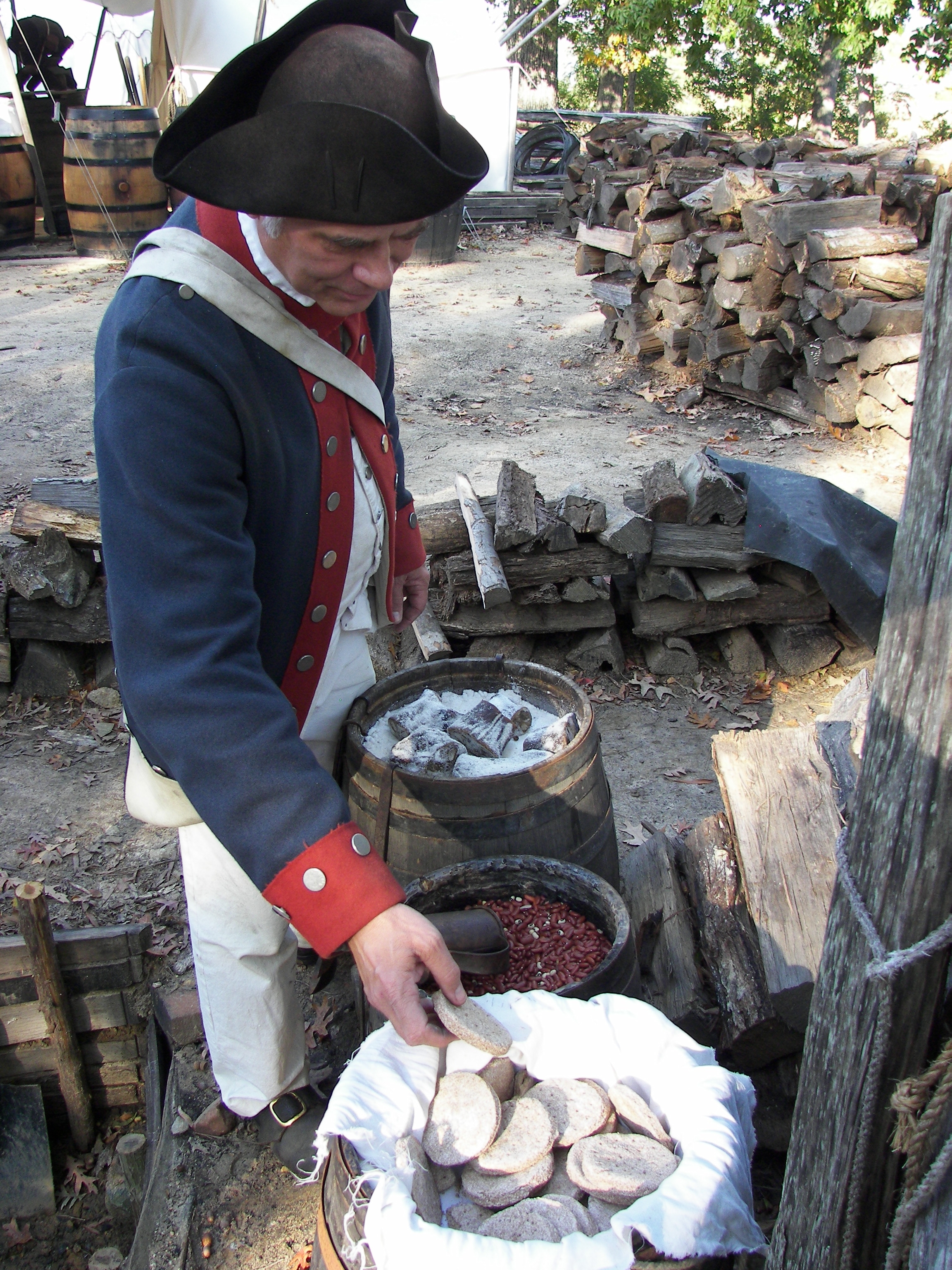 Surveying soldiers' rations in Yorktown Victory Center's re-created Continental Army encampment. Jamestown-Yorktown Foundation photo.