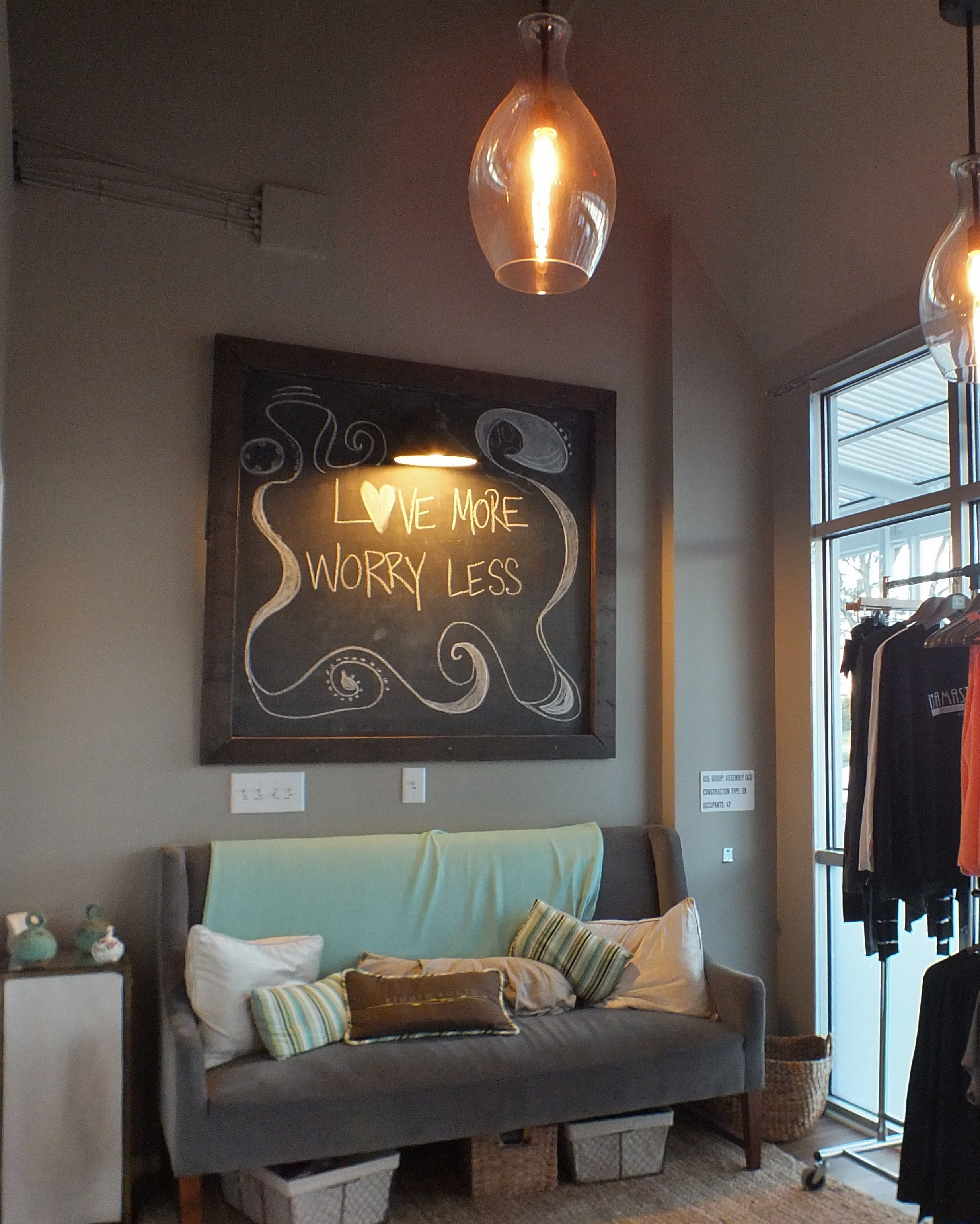 The lobby of Studio South, which asks guests to "Love more, worry less." (Hannah S. Ostroff/ WYDaily)