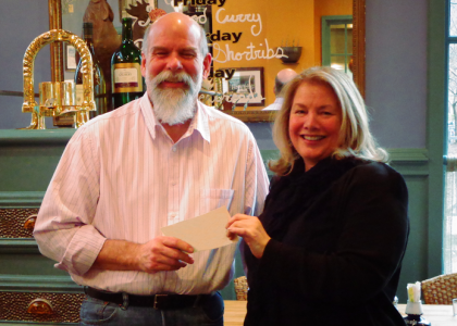 Blue Talon owner David Everett presents a check to Avalon’s executive director Teresa Christin (Submitted)