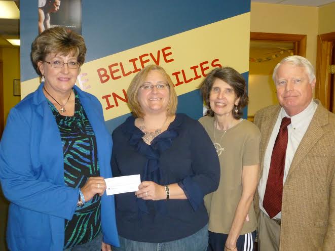 (L-R) Bacon Street administrative assistant Jacquie Brewer, Robin Pardee of Hannah’s Closet, Bacon Street family therapist Laura Townsend, and clinical director Bob Coleman