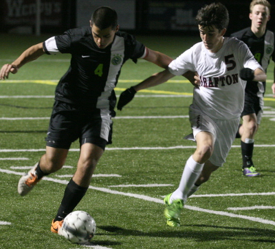 Jamestown's Cap League (left) tries to beat Grafton's ( ) down the sideline (Photo by Will Armbruster/WYDaily)