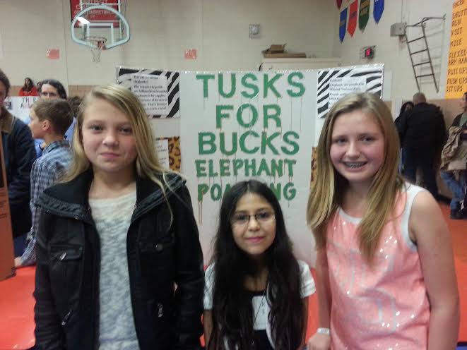 Tabb Middle School fifth-grade students Gracie Cannon, Kaylyn Rivera and Gracie Roberts present their project in the hopes of ending elephant poaching (Submitted)