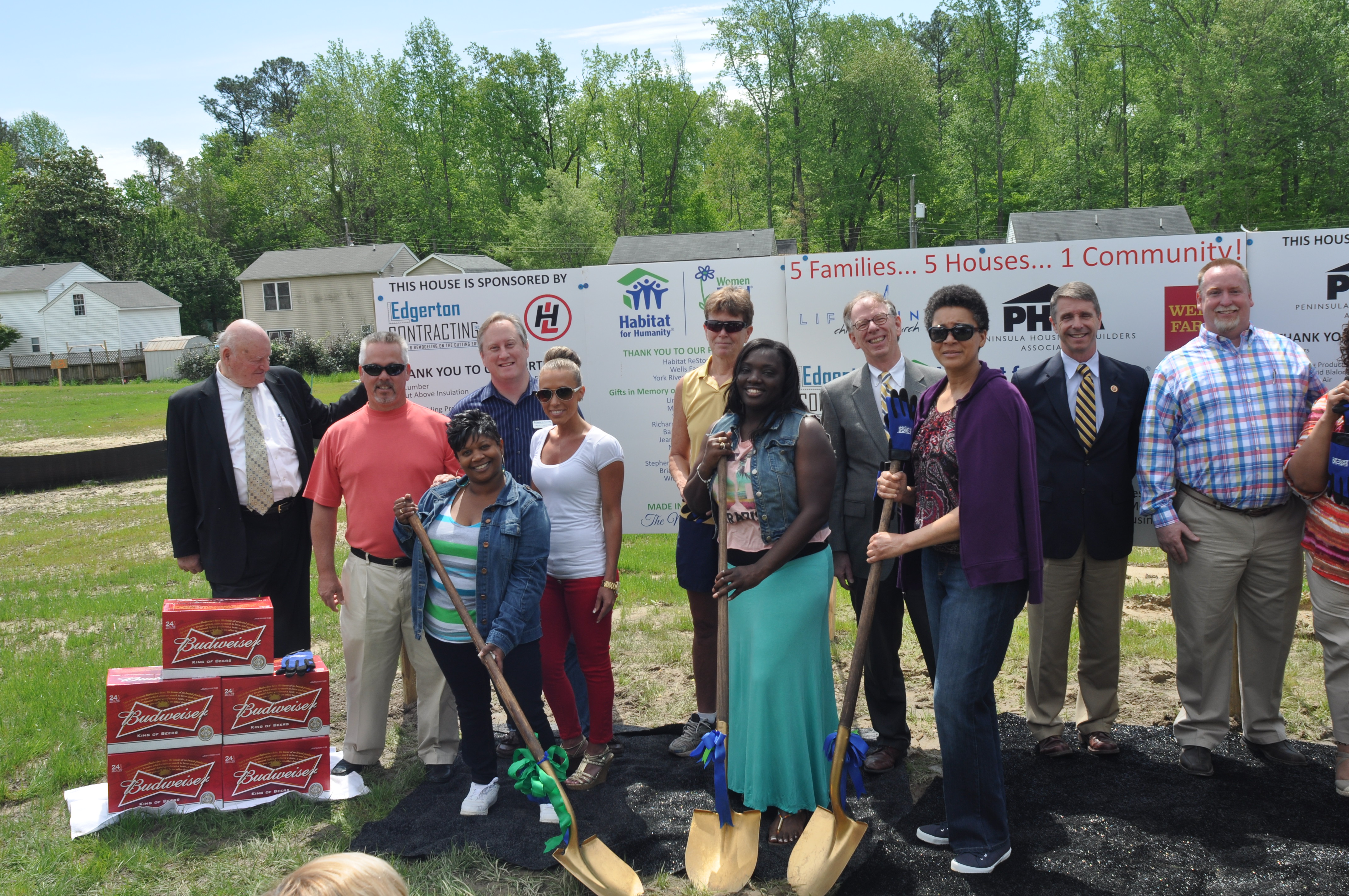 LaKeisha Cowles, Chandre Moore and Angelia Robinson break ground on the site of their new homes. (Photo courtesy Joe Schumacher/Office of Rep. Rob Wittman)