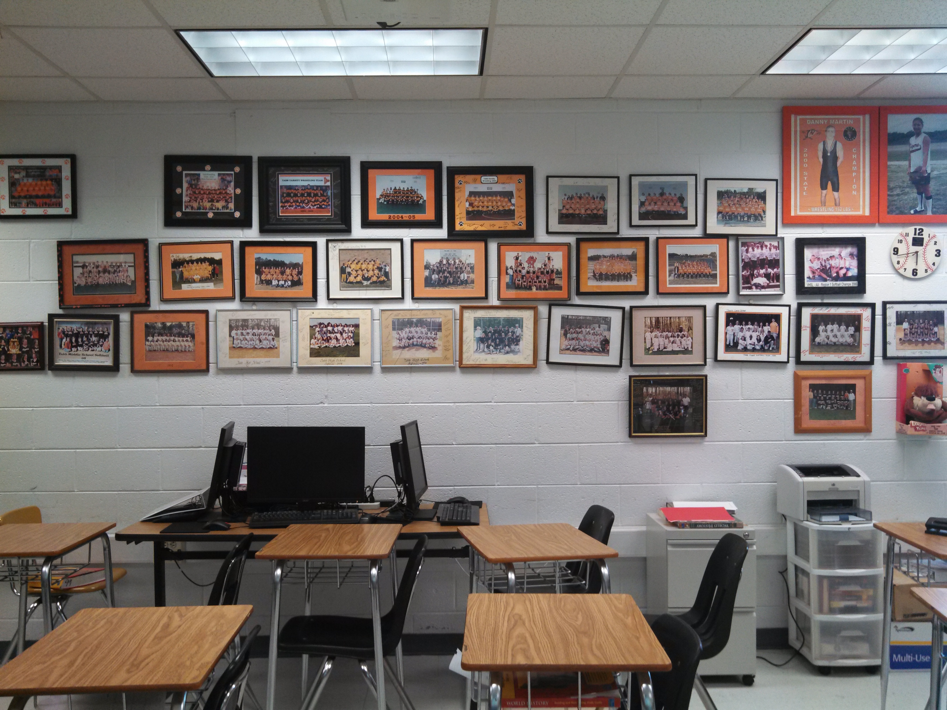 Douglas Roper displays pictures of all the teams he has coached on his classroom wall at Tabb High School (Hannah S. Ostroff/WYDaily)