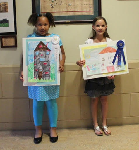 (L-R) Makayla Sturdivant and Sarah Stephens with their winning art (Submitted)