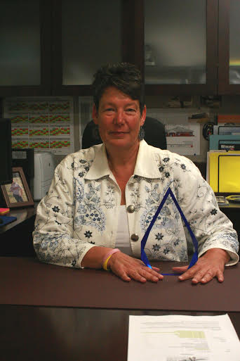 Julie McKercher, director of James City County’s Emergency Communications Division, with her award (Submitted)