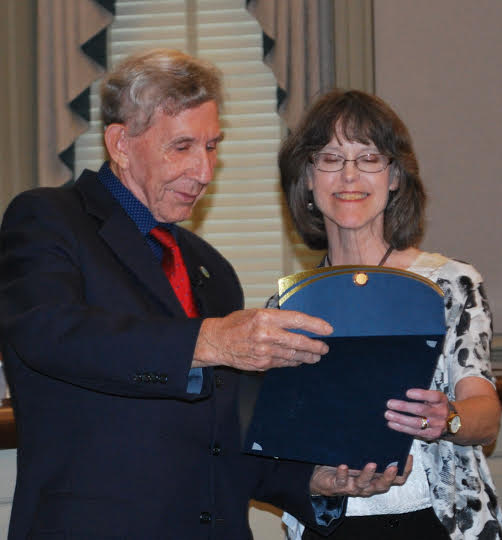 York County Board of Supervisors Chairman Don Wiggins reads a service award to Laurie Coleman, Community Services department director (Submitted)