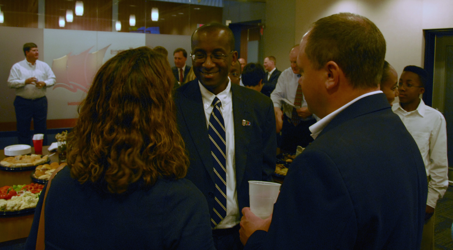 James City County's new administrator Bryan Hill (center) talks with attendees at a meet and greet following his appointment Aug. 8. (Gregory Connolly/WYDaily)