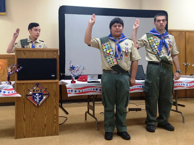 Daniel Mangosing, leader for Williamsburg's Troop 102, administers the Eagle Oath and Eagle Charge to Andrew Lemmon and David Lewis (Submitted)