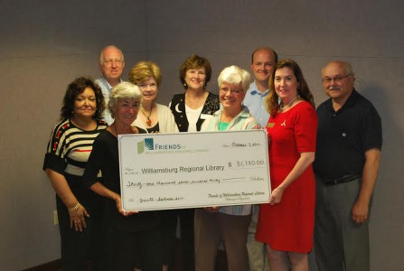 The Friends of the Williamsburg Regional Library present a grant check. (L-R): Ethell Hill, Michael Westfall, President Sandra Stephan, Pat Walsh, Marie Haynes, Vice President Joan Costello, Matt Webster, Library Director Genevieve S. Owens and Jim Bowers (Submitted)