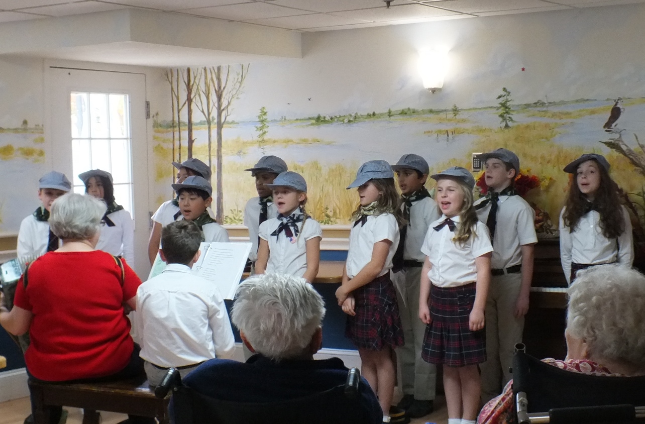 Providence Classical School students performing at Patriot's Colony on Tuesday for Veterans Day (Hannah S. Ostroff/WYDaily)