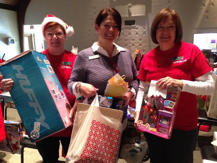 (L-R) Volunteer Ellen Boyko, Director of Pastoral Care and Outreach Shannon Woloszynowski and volunteer Carolyn Borowski pack Christmas gifts for Saint Bede Catholic Church's Angel Tree program (Submitted)