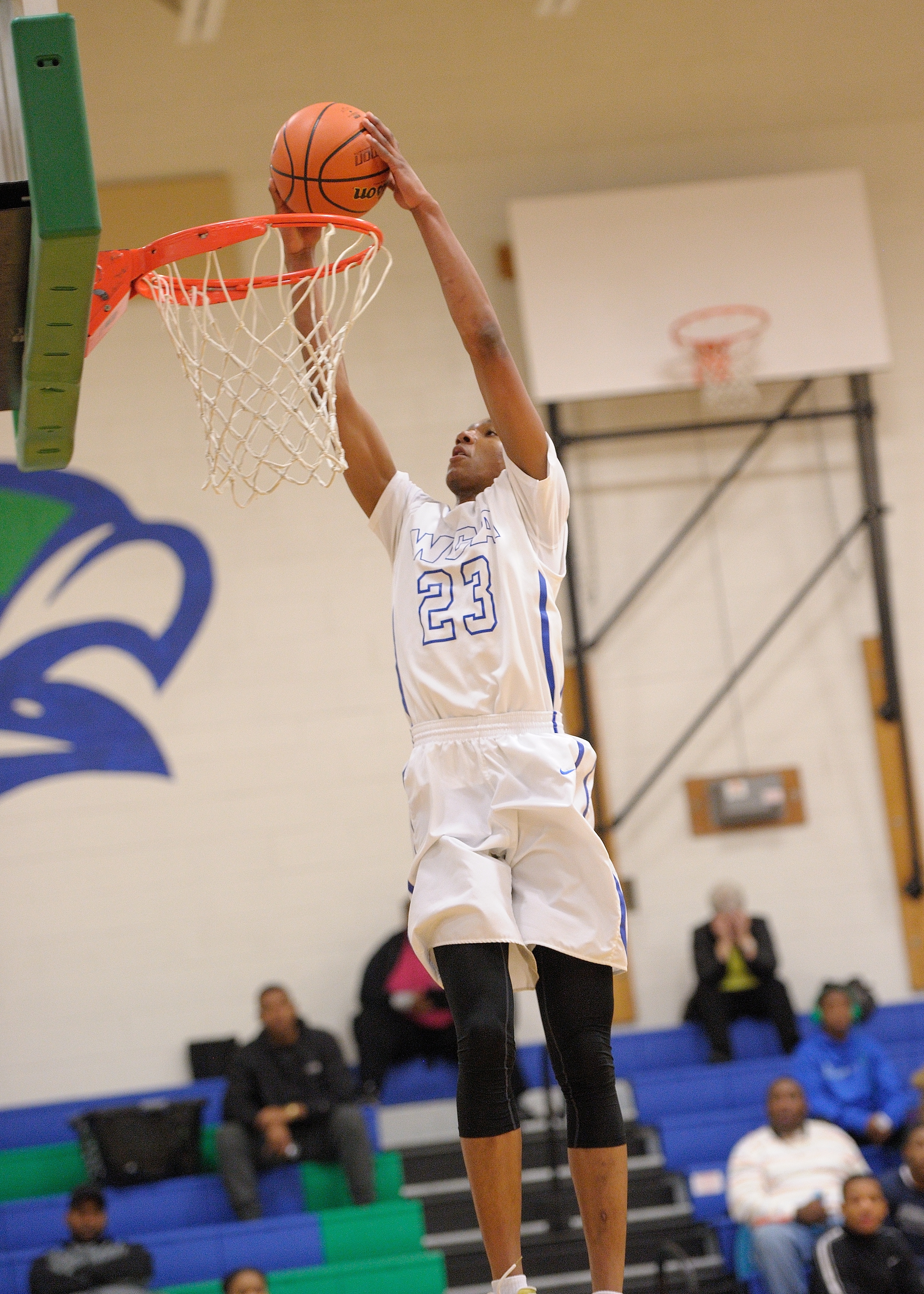 Xavier Green throws down a vicious dunk (Andy Jackson/Savand Action Photography).