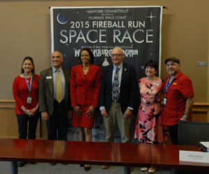 From left to right: Fireball Run Brand Integration Director Aidy Alonzo, Child Development Resources Executive Director Paul Scott, Virginia Tourism Corporation President and CEO Rita McClenny, Williamsburg Mayor Clyde Haulman, Greater Williamsburg Chamber & Tourism Alliance President and CEO Karen Riordan and Fireball Run Executive Producer J. Sanchez pose for a photo during a press conference of the show at the Williamsburg Municipal Building on Monday. (Gregory Connolly/WYDaily)