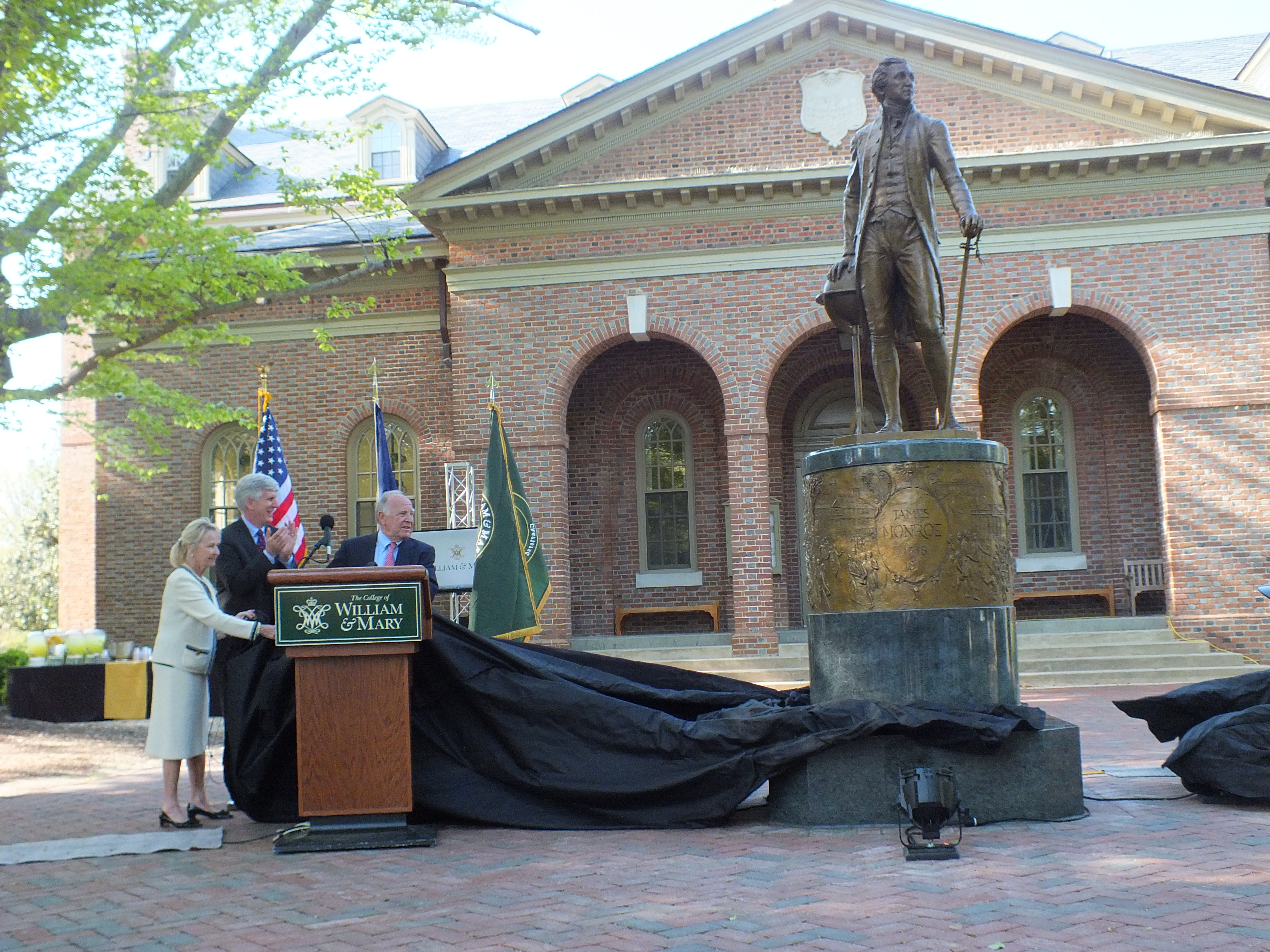 Board of Visitors Rector Todd Stottlemyer pulls the curtain off a statue of James Monroe. (Ian Brickey/WYDaily)