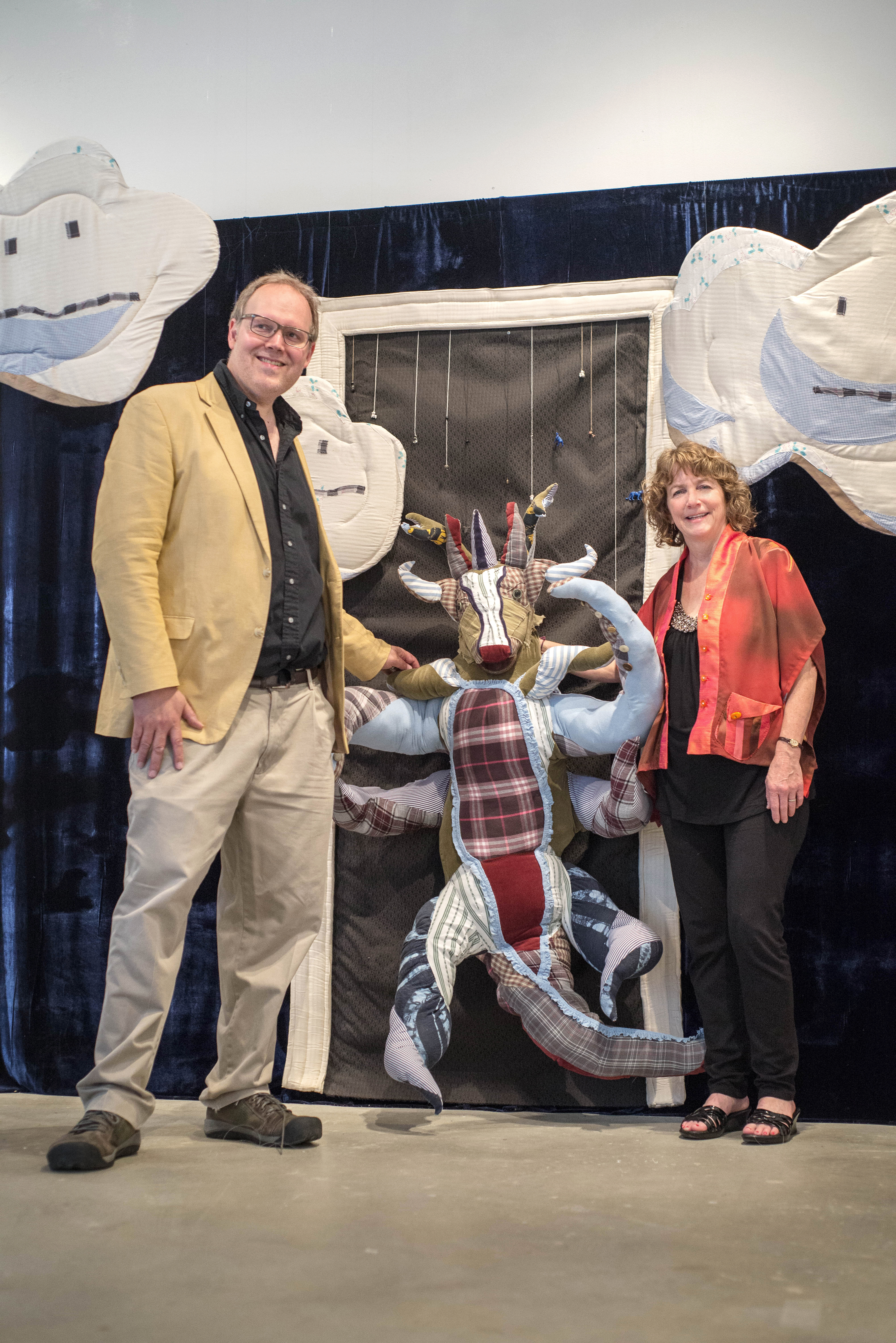 Linda Matney Gallery Owner Lee Matney (left) poses with artist Linda Mitchell and her work "Closet Monster." (Courtesy Linda Matney Gallery)