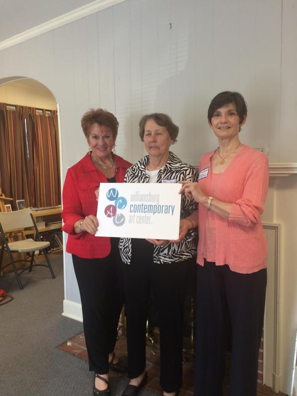 Tempy Barbru, Jane Medlin and Susan pose with the new logo for Williamsburg Contemporary Art Center.