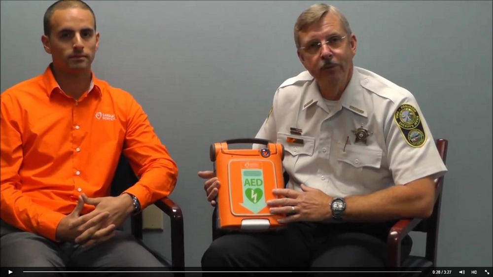 Al Ford, Cardiac Science general manager, and Sheriff J.D. "Danny" Diggs talk about the new equipment. (Courtesy York-Poquoson Sheriff's Office)
