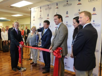 Tim Ryan, director of Launchpad, formerly known as the Greater Williamsburg Business Incubator, cuts the ribbon at the new "pad" in New Town Sept. 18, 2015. (Kirsten Petersen/ WYDaily)
