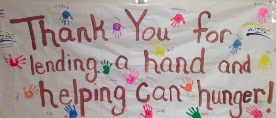 FISH provides food to thousands of people in need in the Williamsburg area every year. Pictured here, a banner hung on the food collection wagon run on behalf of FISH by the Williamsburg Unitarian Universalists. (Courtesy Sally Fisk)