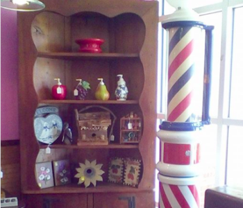 A barber pole from the 1930s is among the collection Donna Berl has amassed more than 35 years of antique-hunting. (Courtesy Donna Berl)