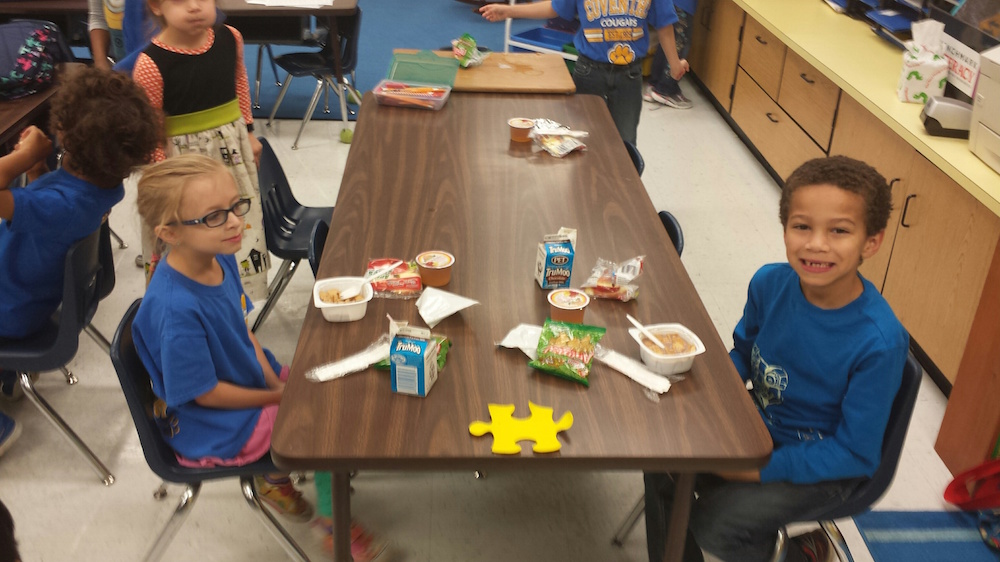 Coventry Elementary School students Madelyn Shields and Juston Shannon enjoy eating breakfast in their first period classroom. (Courtesy YCSD)