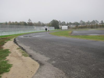 Student athletes run on the track at Jamestown High School, which is set to be repaved next spring. (Kirsten Petersen/ WYDaily)