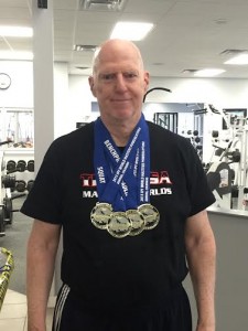 Mike Nichols poses with his world championship medals. (Submitted)