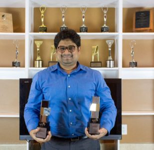 Harshad Methrath, associate creative director, holds the W3 Awards he helped earn for MP&A Digital & Advertising. (Courtesy MP&A)