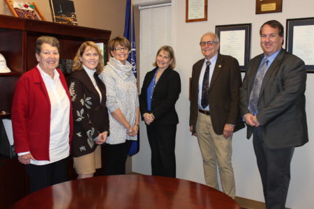 Julie Hummel (third from right) was sworn in Dec. 31 with (from left to right) her predecessor Elise Emanuel, school board member Kyra Cook, Deputy City Clerk Gerry Walton, Mayor Clyde Haulman and City Manager Marvin Collins. (Courtesy of the City of Williamsburg)