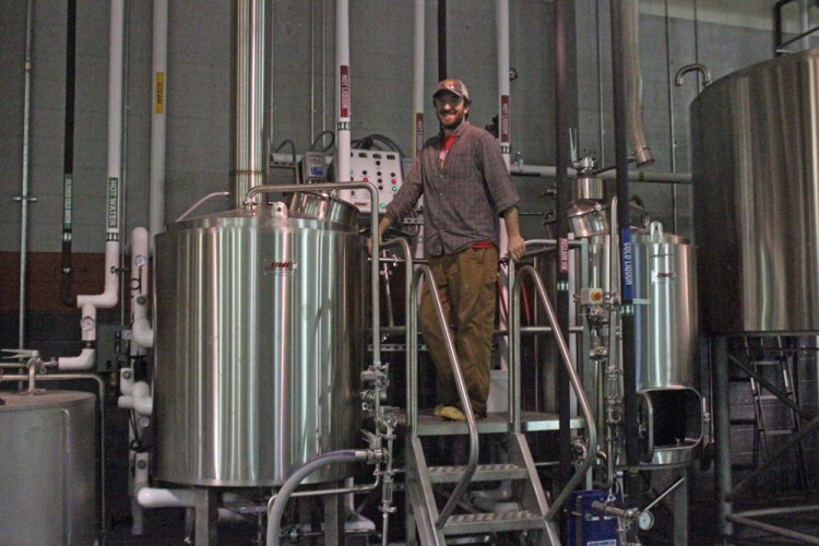 Brewmaster Jonathan Newman stands from the brew deck in Virginia Beer Co. (Nicole Trifone/WYDaily)
