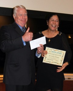 Dr. Evelyn Arboleda received a Distinguished Service Award for her contributions to Bacon Street as volunteer medical director there.