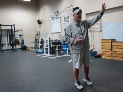 Lafayette head football coach Andy Linn explains the history and function of the weight room Feb. 29, 2016. (Kirsten Petersen/ WYDaily)