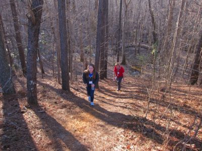 Lafayette student Delaney Savedge, followed by WJCC School Board member Sandy Young (Berkeley), ascends the worn path from WISC Feb. 29, 2016. (Kirsten Petersen/ WYDaily)