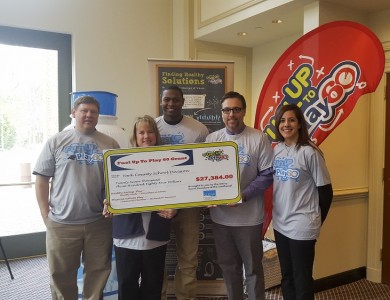 From left to right, Tim Miller, Sodexo operations manager; Michelle Knotts, Sodexo food services director; Everette Brown, NFL Player for the Washington Redskins; Albert Green, YCSD associate director of school administration; and Roseanne Liberatore, manager of school health and wellness for the Southeast United Dairy Industry Association. (YCSD)