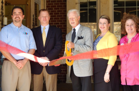 Neal Clarke, owner of Capriccio Ristorante, cuts the ribbon at his Italian restaurant in New Town. (JCC)