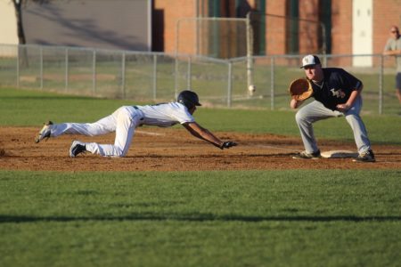Garrick Colorado dives back to first base. (file photo)