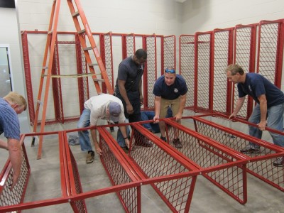 Members of the James City-Bruton Volunteer Fire Department set up lockers in the new fire station in Toano May 11, 2016. (Kirsten Petersen/ WYDaily)