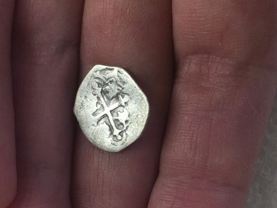 A Spanish coin found in the churchyard dig that appears to be from the reign of King Philip IV. (Courtesy Danny Schmidt)