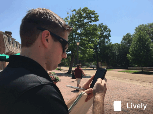 Ty Hodges catches a Pokemon on Duke of Gloucester Street July 7, 2016. (Kirsten Petersen/ WYDaily)