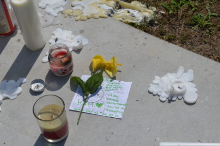 A memorial in front of 1094 Stewart Drive was created for Kameron Stanley, 18, who was shot to death Friday evening. (Kim Lenz/WYDaily)
