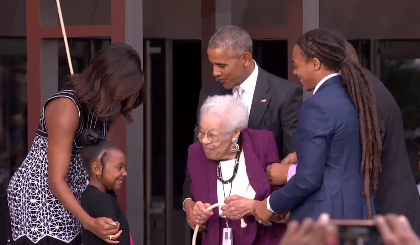President Barack Obama and the first lady Michelle Obama ring the First Baptist Freedom Bell with 99-year-old Ruth Bonner and her family. Ruth’s father was born into slavery, but escaped to freedom and eventually graduated from medical school. (NMAAHC Live Stream)