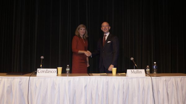 Heather Cordasco (R) and Mike Mullin (D) shake hands after the League of Women Voters of the Williamsburg area forum in 2016. (Steve Roberts, Jr./WYDaily)