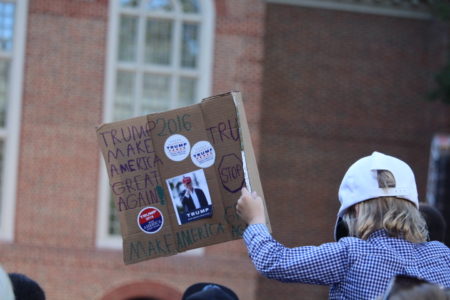 A boy holds up a sign that reads "Trump 2016 Make America Great Again." The boy attended a Donald Trump rally at Regent University in Virginia Beach on Oct. 22. (Adrienne Marie Mayfield/WYDaily)