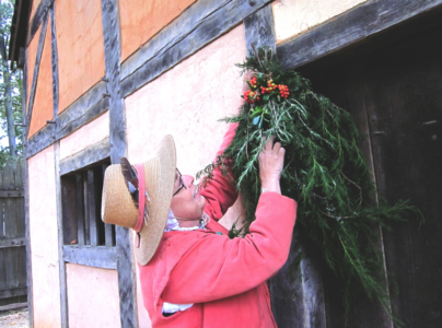 In Jamestown Settlement's re-created 1610-1614 fort, see natural greenery adorning buildings for the holidays. (Photo courtesy Jamestown-Yorktown Foundation)
