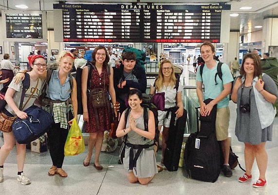 Left to right: Caroline Redick, Caroline Scruggs, Kelly Agnew, Samuel Corey, Jeanette Corey (kneeling), Alie Astete, Will Fruchterman and Lizzy Corey at the train station in New York City. (Photos courtesy Jeanette Corey)